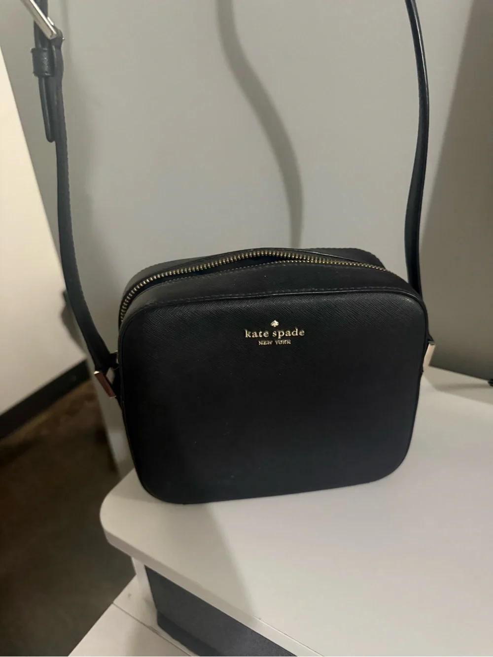 kate spade black crossbody camera bag with gold logo